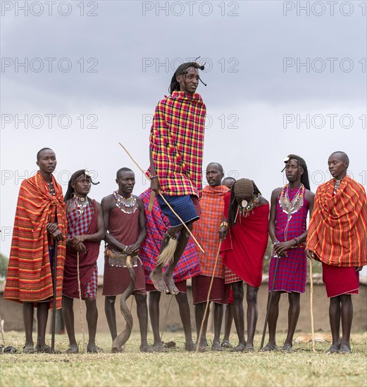 Maasai people preforming the traditional jumping dance in a Maasai village in Maasai Mara, Kenya,