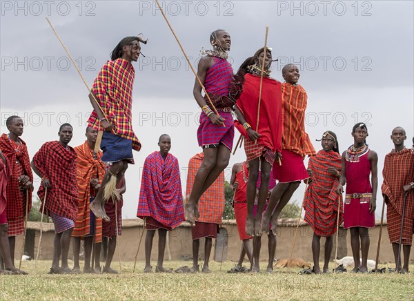 Maasai people preforming the traditional jumping dance in a Maasai village in Maasai Mara, Kenya,