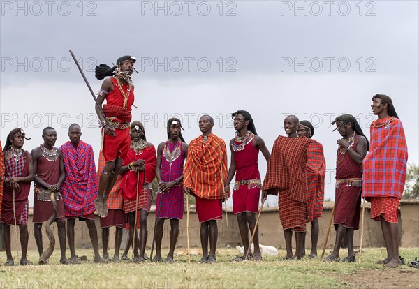 Maasai people preforming the traditional jumping dance in a Maasai village in Maasai Mara, Kenya,