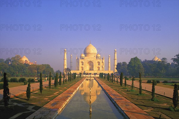 Classic early-morning view of the Taj Mahal reflecting in still water, Agra, India, Asia