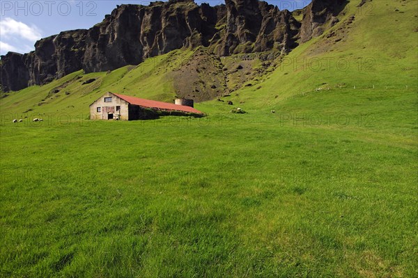 Barn or sheep-shed beneath basalt crags near the farming township of Foss, southern Iceland