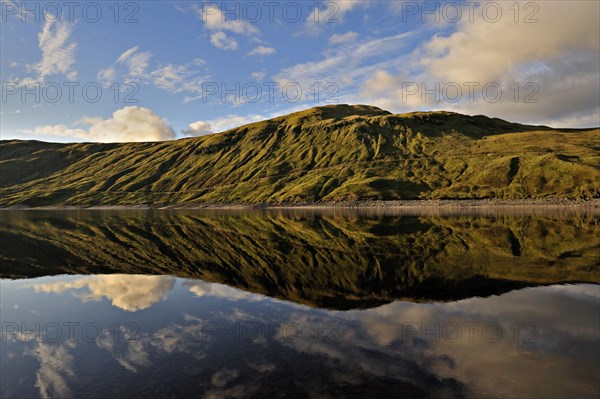 Hydro-electric reservoir at Loch Lyon with distant ridgeline, Glen Lyon, Perthshire, Scotland, UK