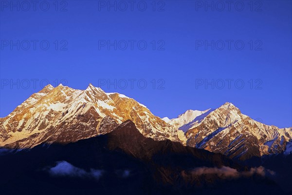 Sunset light on the Annapurna range from 15000 feet on the Thulobugin Ridge above the Kali Gandaki