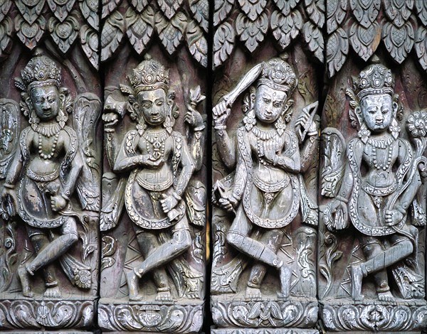 17th century frieze of carved wooden figures in a temple complex in Patan in the Kathmandu valley,