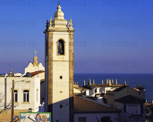 Early morning light on the houses and church of the old town of Albufeira, Algarve, Portugal,