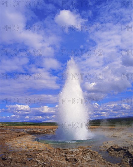 The geyser Strokkur begins a new eruption (every 15 minutes), Haukadale, Iceland, Europe