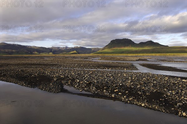 Evening light on the braids of the Syslalaekur river, with dappled light on distant hills, southern
