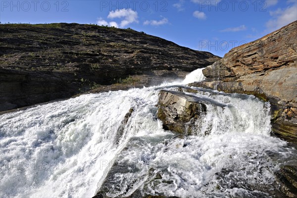 Meltwater from the Osterdalsisen glacier on the way down to Svartisvatnet, Svartisdalen, Norway,