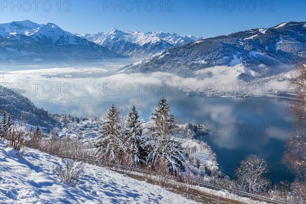 Winter panorama of Lake Zell in morning fog with the Kitzsteinhorn 3203m in the Hohe Tauern,