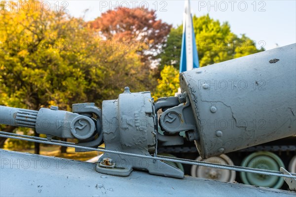 Closeup of intermediate gear box and u-joints of connecting tail rotor drive shaft on helicopter on