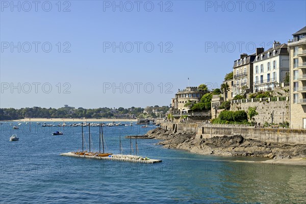 Fortified coastline with buildings on the rocky shore in Dinard, Ille-et-Vilaine, Brittany, France,