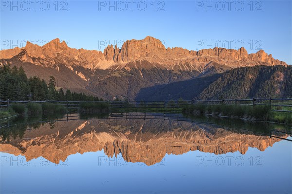 Mountains reflected in a small mountain lake, sunset, evening light, Wuhnleger, view of rose
