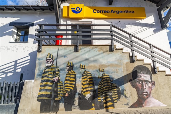 Graffito with men in convict clothing as a reminder of the historic penal colony on the post office