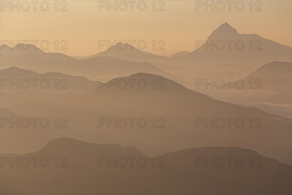 Mountain peak in the haze, sunrise, summer, view from Jochberg to Guffert and Bavarian Alps, Upper