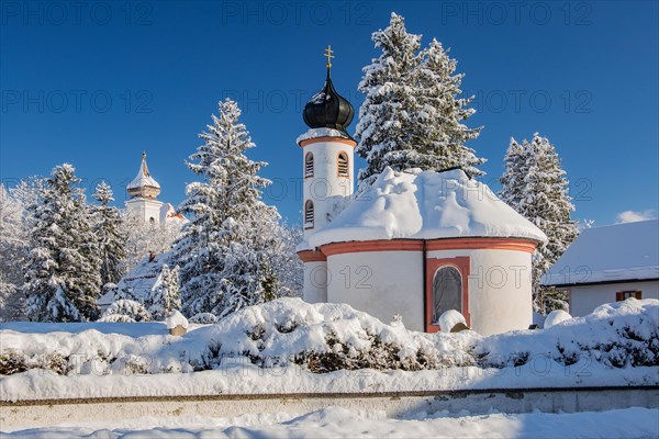 Winter atmosphere with snow-covered small chapel at Schlehdorf Monastery, Schlehdorf, Lake Kochel,