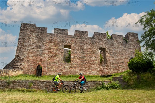 Mountain bikers take a break at the Wolfsburg above Neustadt in the Palatinate Forest, Germany,