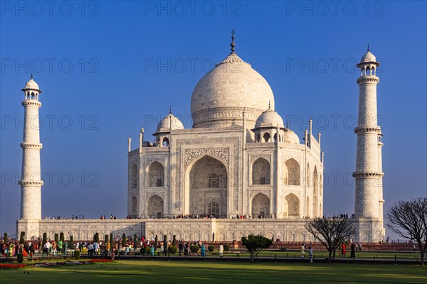 The imposing Taj Mahal surrounded by crowds under a clear sky during the day, Taj Mahal, Agra,