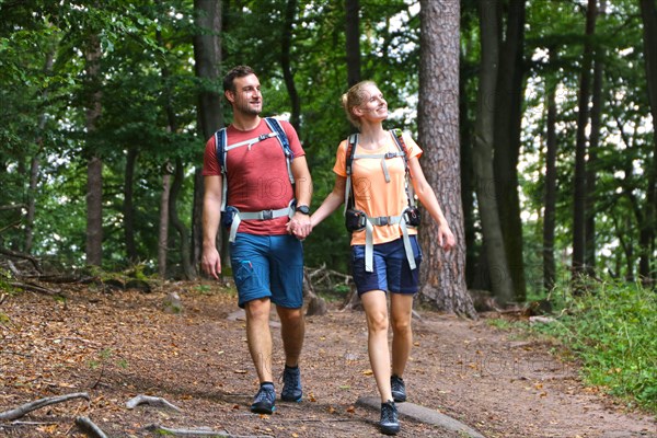 Symbolic image: Young couple hiking in the Palatinate Forest, here on the fifth stage of the