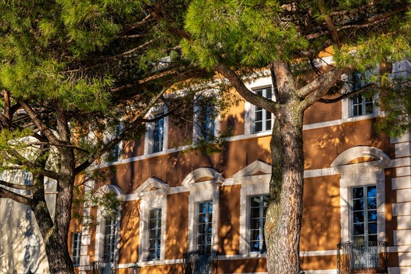 Old Beautiful Town with Shadows on Building and Trees in a Sunny Day in Morcote, Ticino,