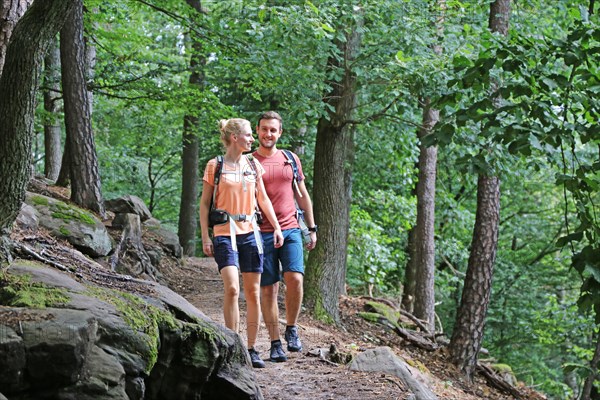 Symbolic image: Young couple hiking in the Palatinate Forest, here on the fifth stage of the