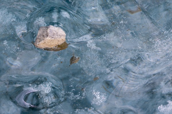 Trapped stone in an ice structure, glacier cave, winter, Morteratsch glacier, Pontresina, Engadine,