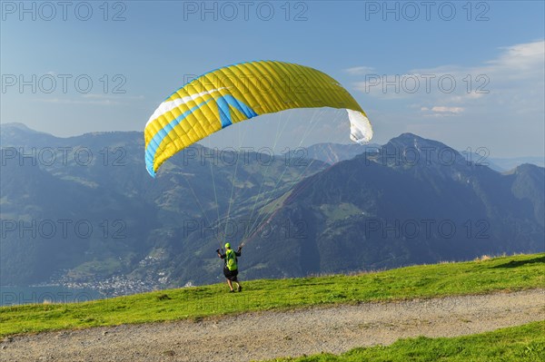 Paragliders on the Niederbauen with a view of the Rigi, Lake Lucerne, Canton Uri, Switzerland, Lake