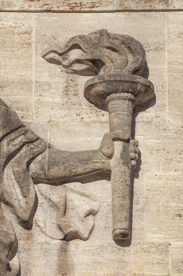 Bearer of the Olympic flame at the entrance portal, Olympic Stadium, 1936 venue of the Winter