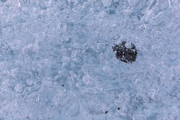 Trapped stone in an ice structure, glacier cave, winter, Morteratsch glacier, Pontresina, Engadine,