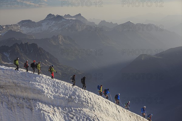 Mountaineer on glacier in the morning light, Group, Mont Blanc Massif, French Alps, Chamonix,