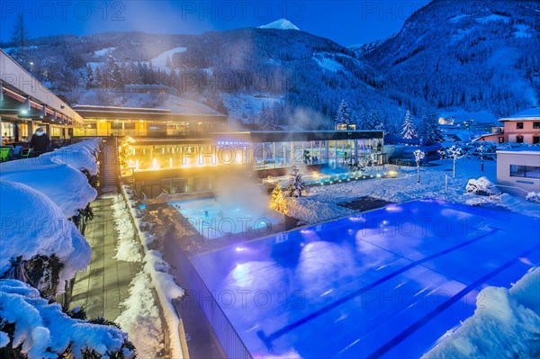 Snow-covered rock spa in winter, thermal bath at dusk, Bad Gastein, Gastein Valley, Hohe Tauern