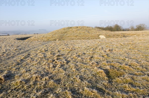 Bronze Age bowl barrow on Windmill Hill, a Neolithic causewayed enclosure, near Avebury, Wiltshire,