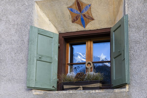 Windows on historic house, sgraffito, facade decorations, shutters, Guarda, Engadin, Grisons,
