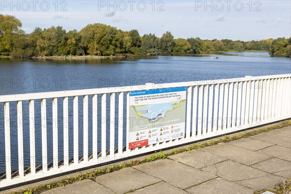 Alton Water reservoir lake, Tattingstone, Suffolk, England, UK notice warning of hidden submerged