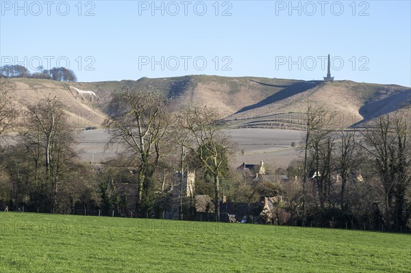 White horse, Lansdowne monument, Oldbury Camp hill fort, chalk scarp slope, Cherhill village,