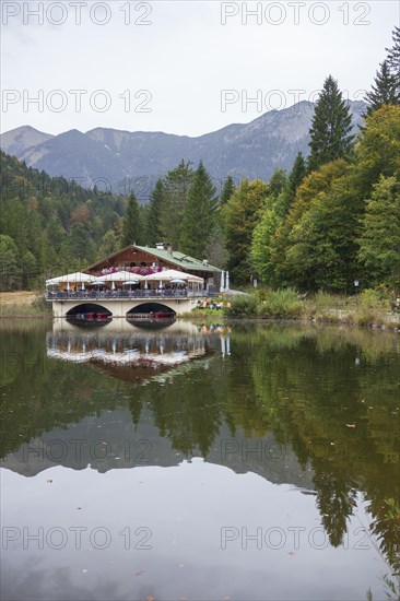 Pflegersee with inn under a cloudy sky, Garmisch-Partenkirchen, Werdenfelser Land, Upper Bavaria,