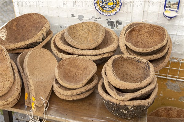 Close up of shop display of bowls made from cork oak tourist souvenir products on sale, city of