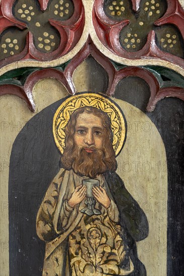 Victorian rood screen paintings of saints, Bildeston church, Suffolk, England, UK, Saint John c