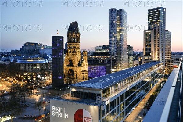 View of Breitscheidplatz in the evening with the Bikini building, the Kaiser Wilhelm Memorial