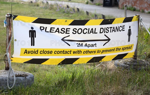 Please Social Distance 2 metres apart banner Avoid close contact with others to prevent the spread,