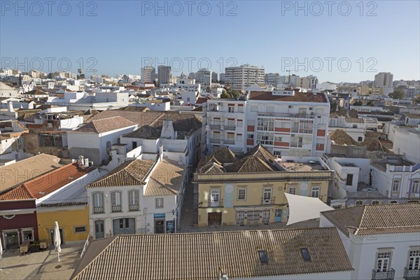 High density roof top view of buildings crowded together in the city centre of Faro, Algarve,