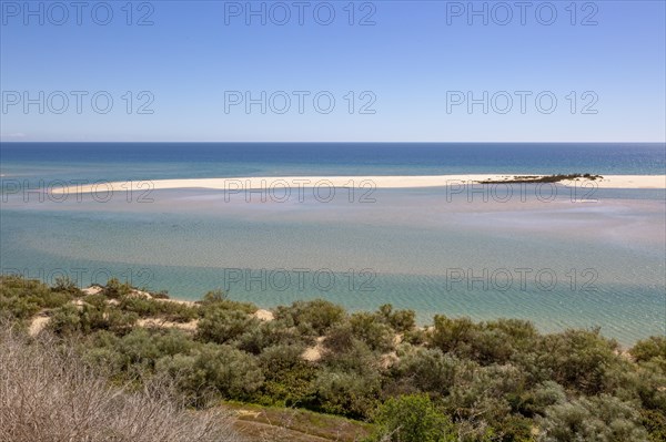 Coastal wooded landscape of pristine beaches and lagoon behind offshore sandbar, Cacela Velha, Vila