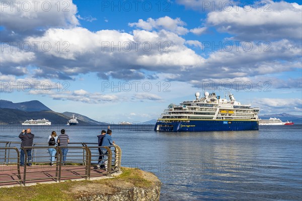 People watching cruise ships in the harbour at the Beagle Channel, Ushuaia, Tierra del Fuego