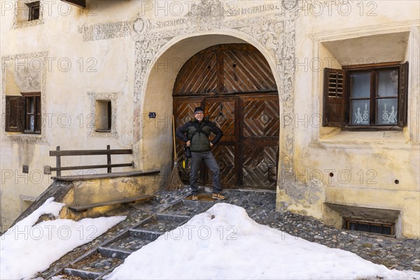 House entrance door, window, historic house, sgraffito, facade decorations, Guarda, Engadin,