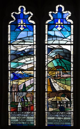 Modern stained glass window in church of Saints Peter and Paul, Marden, Wiltshire, England, UK by