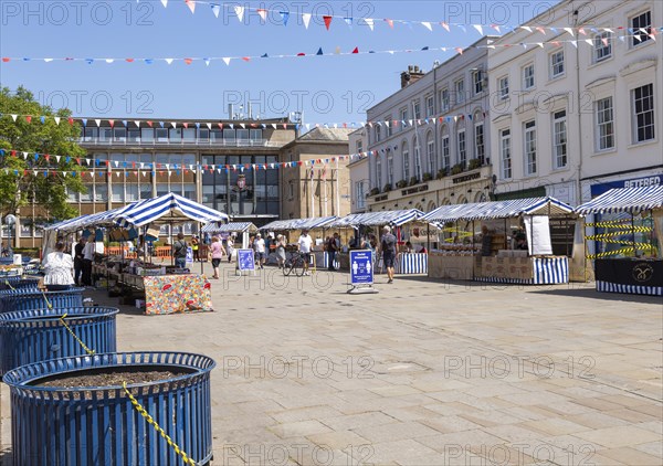 As lockdown eases a small number of shoppers and few stallholders attend the open air market,