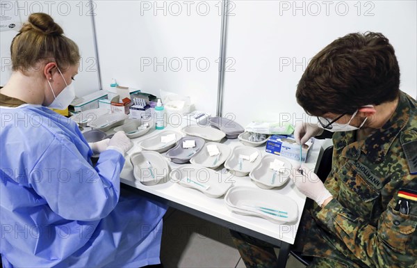 Syringes are filled with the Covid19 Biontech Pfizer vaccine Comirnaty in a vaccination centre by