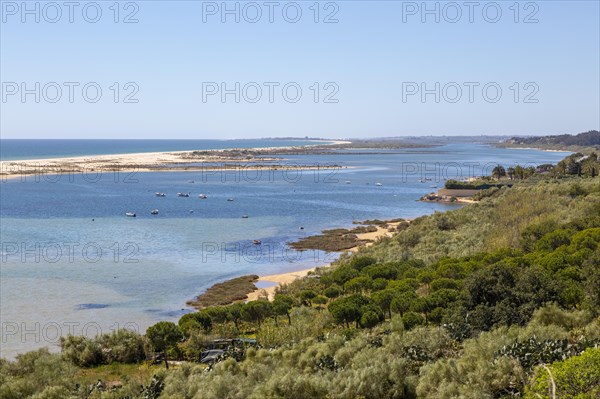Coastal wooded landscape of pristine beaches and lagoon behind offshore sandbar, Cacela Velha, Vila