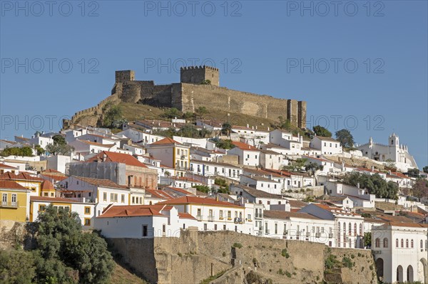 Historic hilltop walled medieval village of Mertola with castle and fortified walls, Baixo