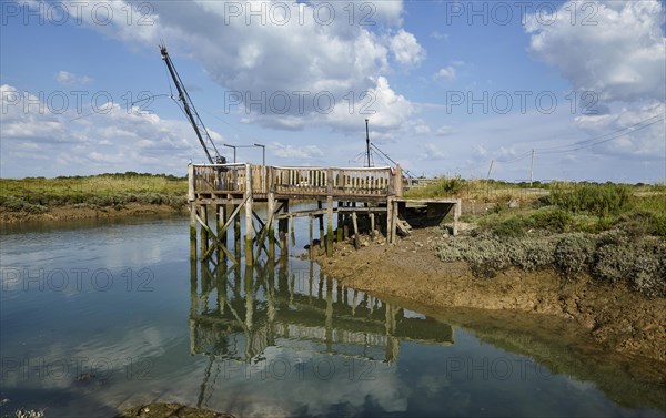 Canal and crane for oyster farming in Saint-Pierre-d'Oleron, Departement Charente-Maritime,