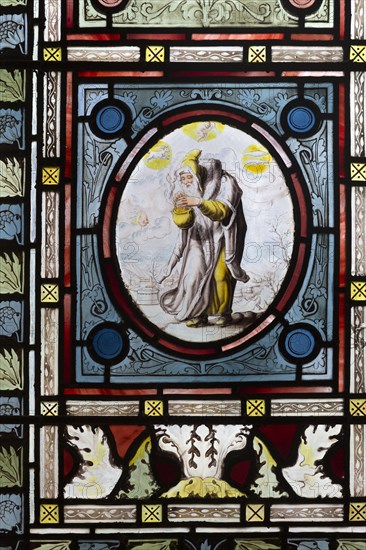 Flemish images in stained glass window church of Saint John, Saxmundham, Suffolk, England, UK